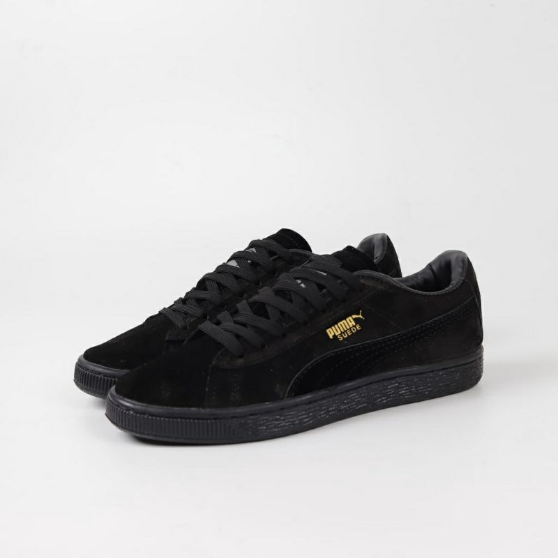 black white puma trainers