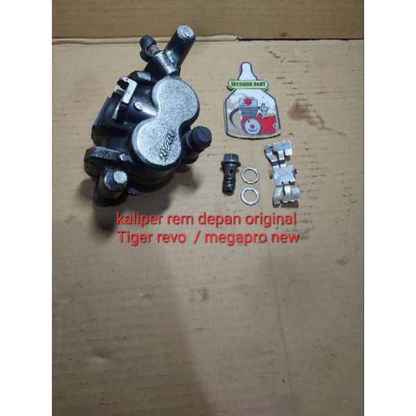 kaliper depan megapro tiger revo original