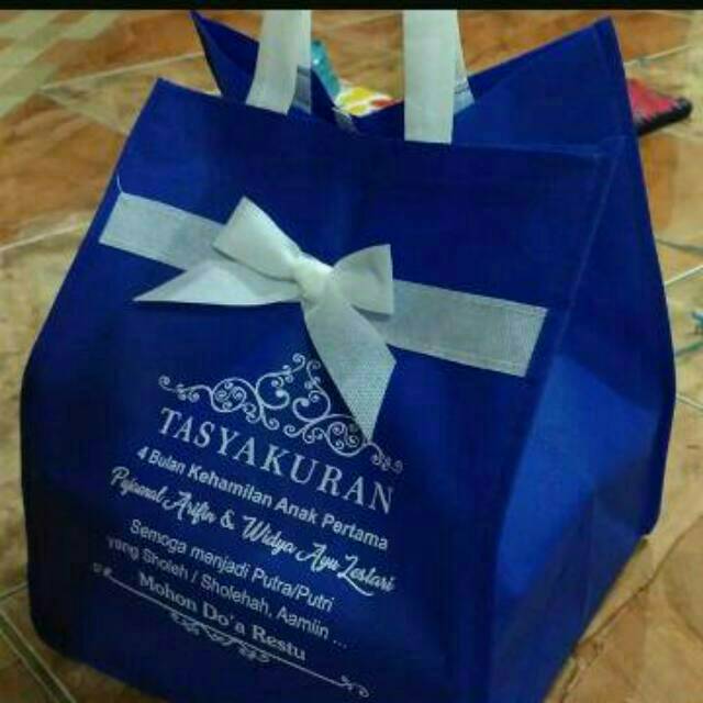 

Souvenir Tas jinjing tas besek tas spounbond pita 22cm tas nasi kotak