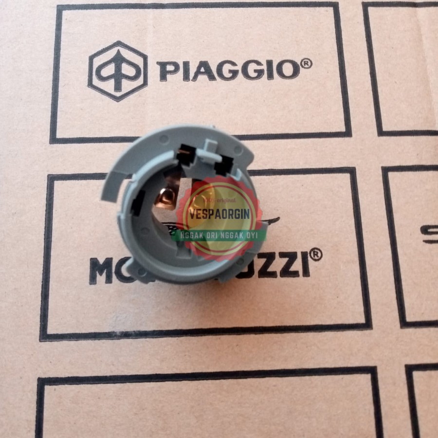 Fiting lampu depan piaggio zip