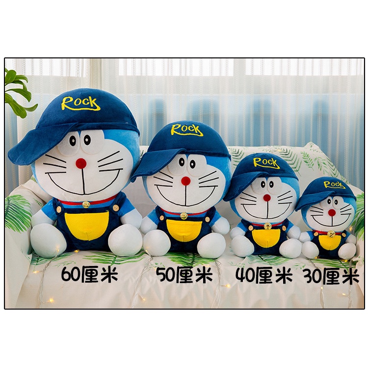 Boneka doraemon kostum pakai topi rock bahan plush