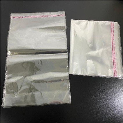 ( Pak 50 Lembar ) PLASTIC MICA GLUE BOOK COVER - SAMPUL BUKU TULIS BENING TRANSPARANT KACA PLASTIK LEM - O.P.P KWARTO A5 ZIBIZ