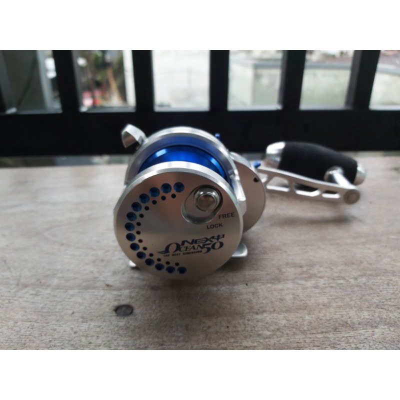 Reel Poseidon Ocean Next 50 L handle kiri