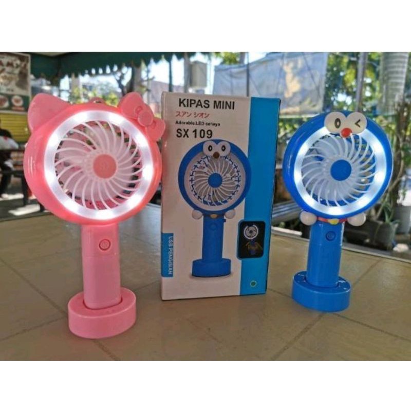 kipas angin portable mini fan gengam bisa berdiri ada dudukan pakai baterai charger