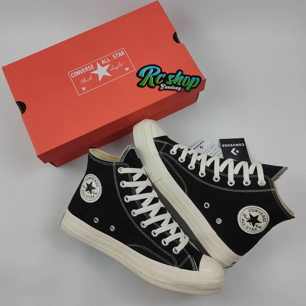 white converse rainbow bottom