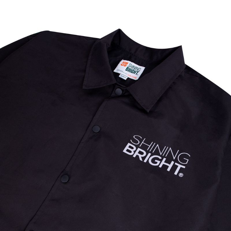 SHINING BRIGHT COACH JAKET BLACK AND WHITE LOGO