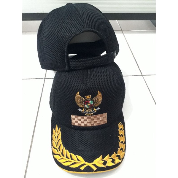 Topi Camat kades Hitam Jaring Dobelmess