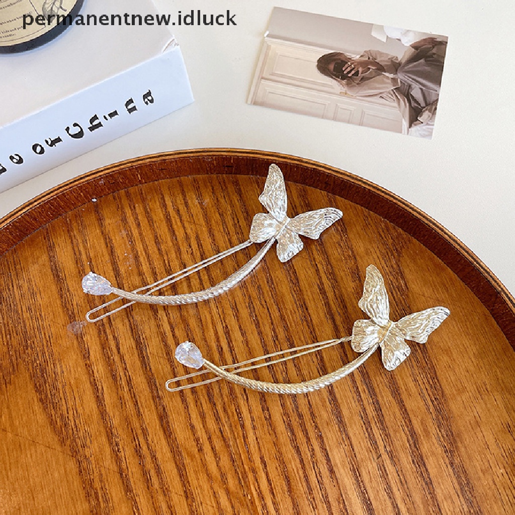 Jepit Rambut Model Butterfly Aksen Mutiara Bahan Metal Gaya Retro Untuk Wanita