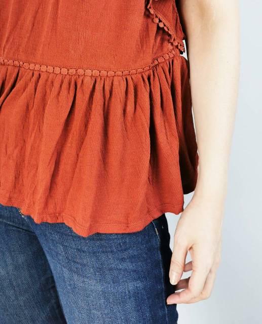 K rose spice orange ruffled top