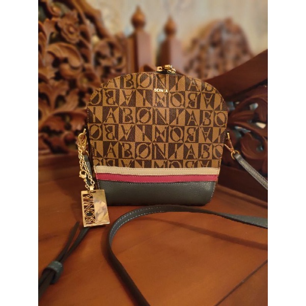 Preloved bonia sling list merah putih