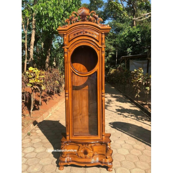 1 SET LEMARI JAM UKIR TIANG ULIR BAHAN KAYU JATI SUDAH DI LENGKAPI DENGAN JAM DAN KACA FINISHING NATURAL JEPARA-2