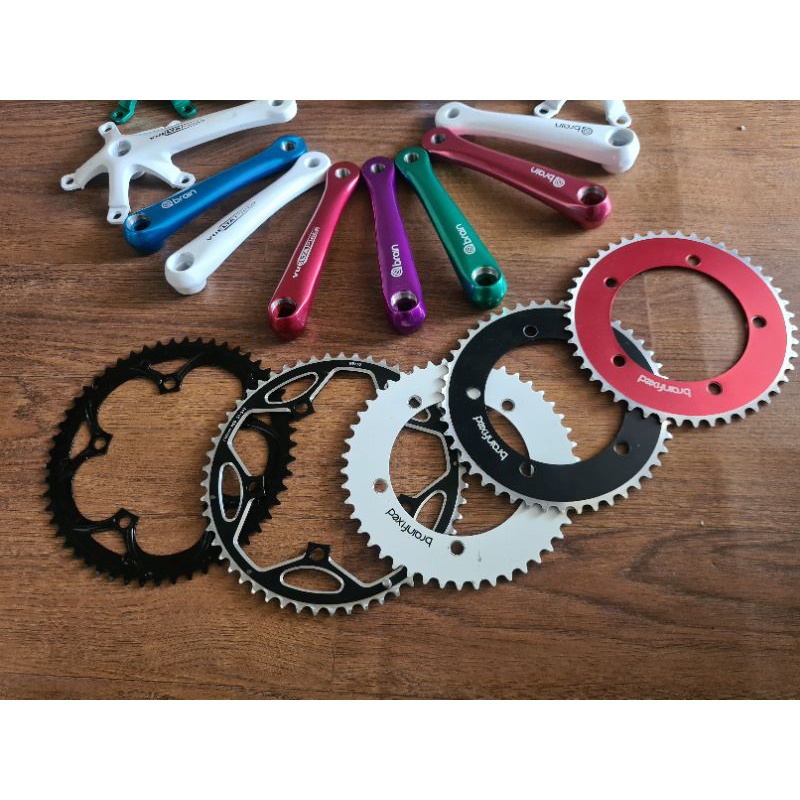 Crank Arm Set Sepeda Lipat Fixie Seli Folding Bike Fixed Gear Single Merk Brain Vuelta Pista Crankset Chainring 46T 53T Chain Ring 46 53 T Alloy Arm Panjang 165mm 165 mm BCD 130mm 130 mm Alumunium Baut Bolt Nut Merah Ungu Biru Hijau Putih bicycle roadbike