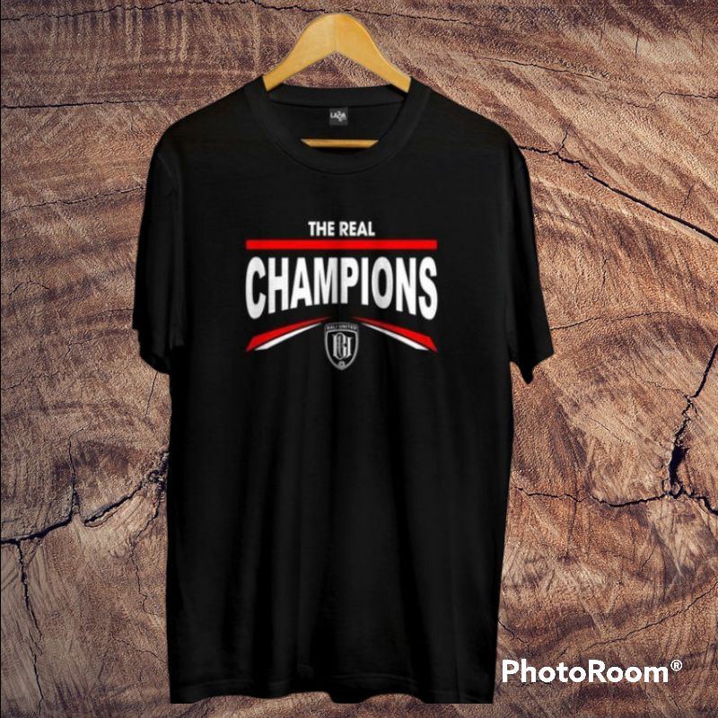 0Baju T-shirt Kaos THE REAL CHAMPIONS l Kaos Edisi khusus Bali United juara Liga 1 Indonesia l Kaos 