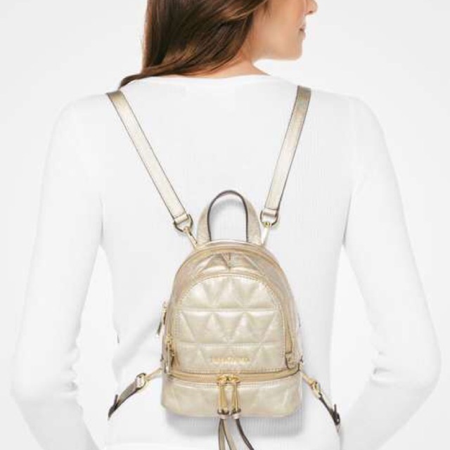Preloved MK Rhea Mini Metallic Quilted Leather Backpack in Pale Gold