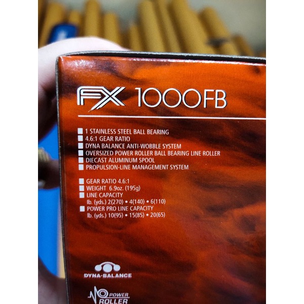 reel pancing shimano fx 1000 bonus topi