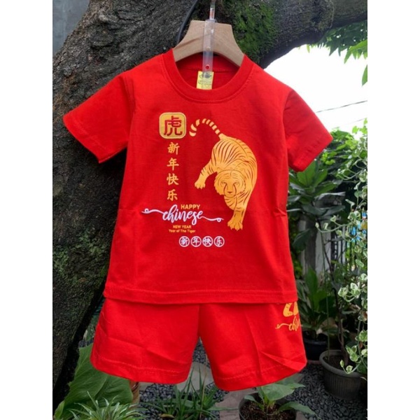 Kaos merah macan imlek