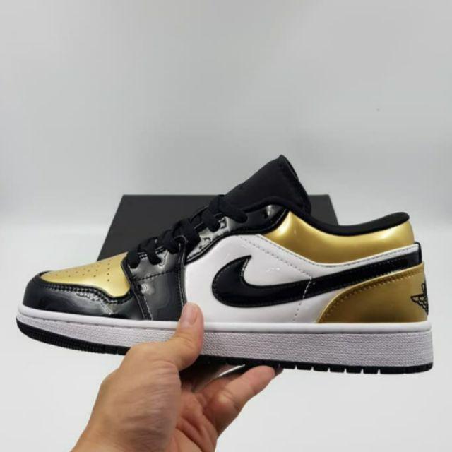 gold and black jordan 1 low