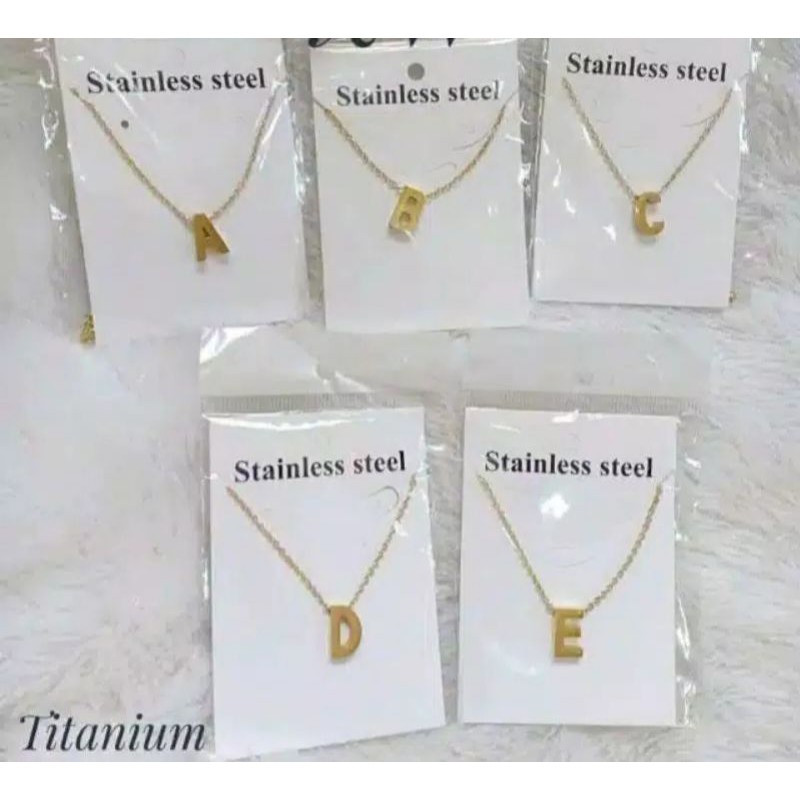 KALUNG TITANIUM ALPHABET WARNA EMAS