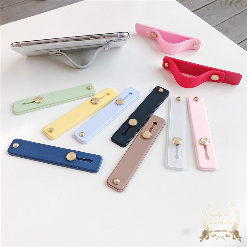 Stand Holder Smartphone Universal Bahan Silikon Dengan Strap Pergelangan Tangan