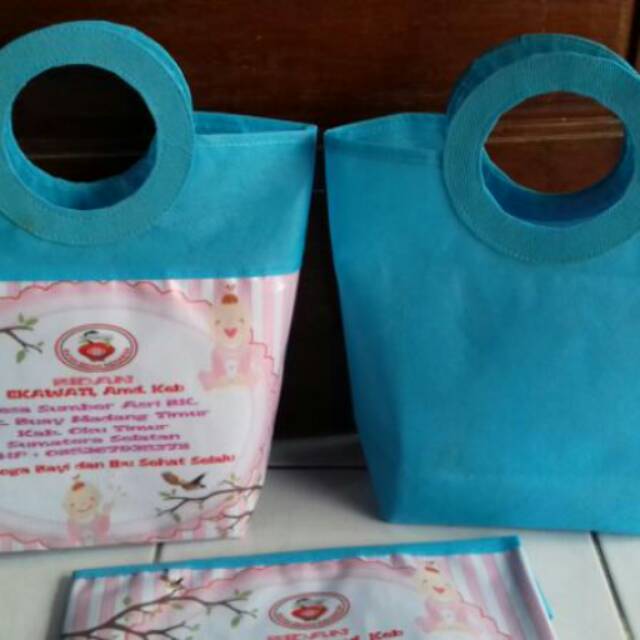 

Tas souvenir model pegangan bulat