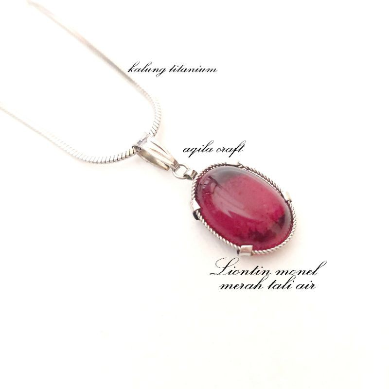 KALUNG TITANIUM LIONTIN MONEL MATA MERAH TALI AIR