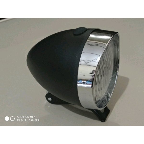 Lampu depan sepeda klasik vintage onthel