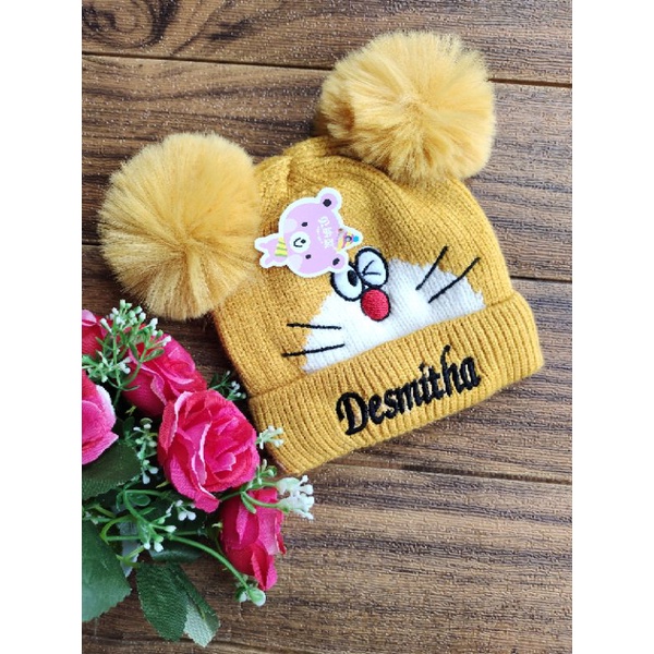 topi rajut pom2 Doraemon bayi tanpa  plus nama