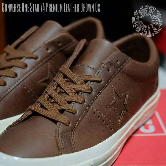 brown converse with star