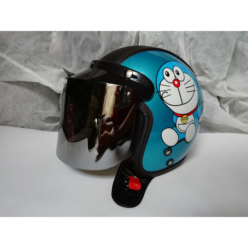 HELM BOGO DORAEMON BIRU MUDA SEMI KULIT DEWASA KACA DATAR SILVER
