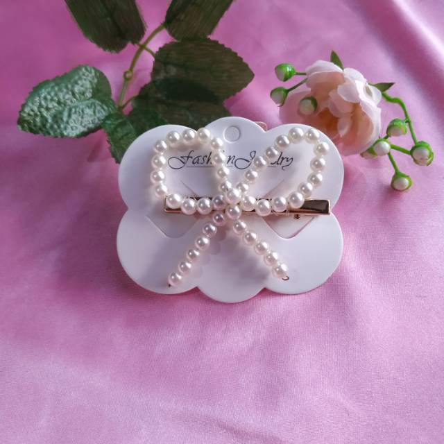 

Jepitan pearl pita besar