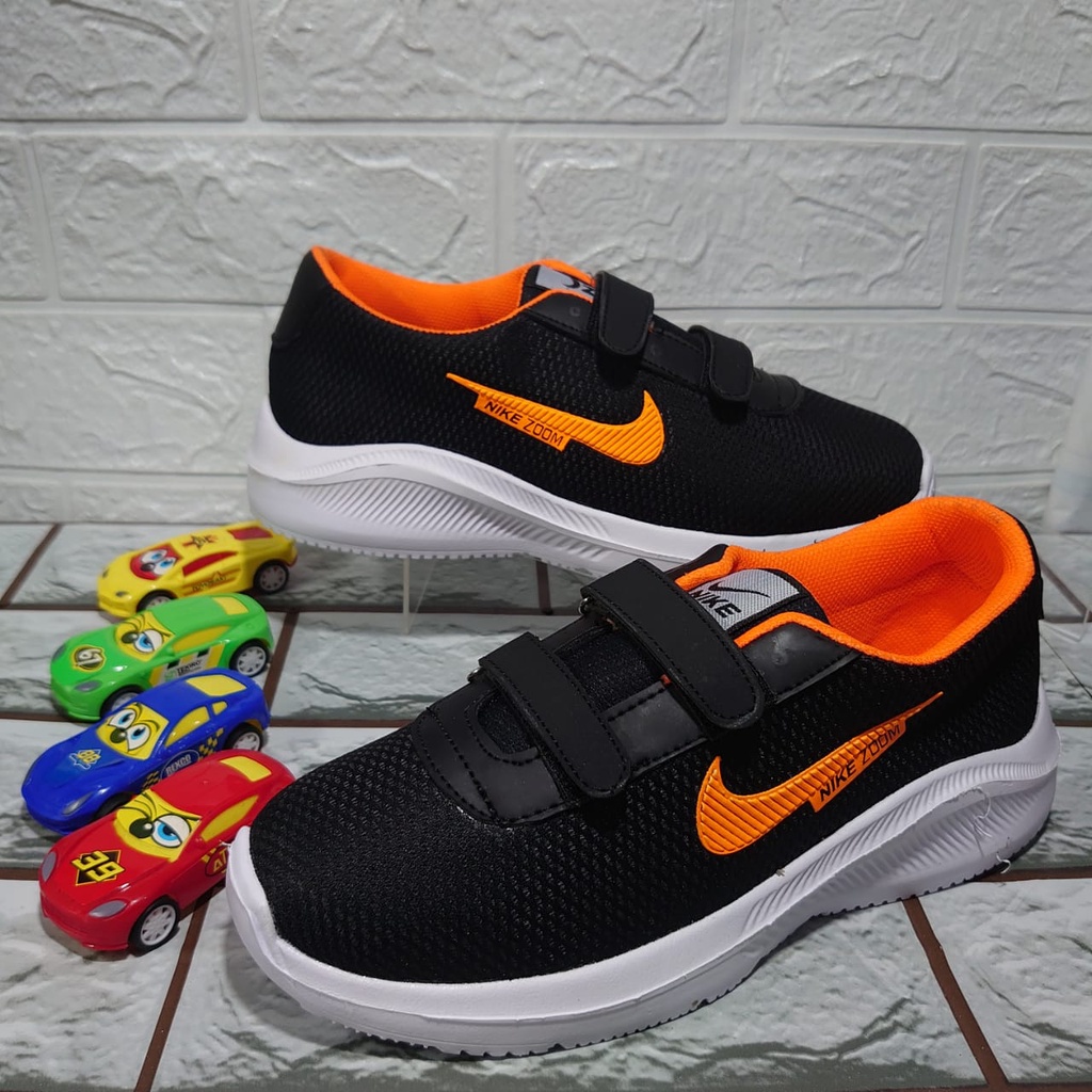 Sepatu Sneakers Sepatu Anak Import zoom Size hitam oranye perekat 26-37 Usia 4-10 Tahun