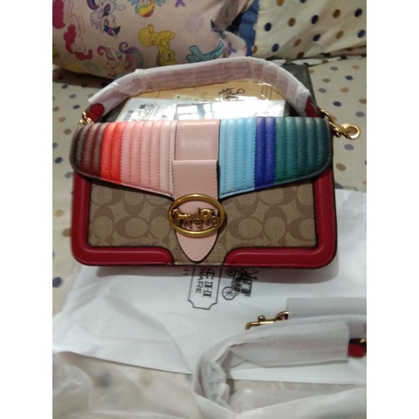 Tas Coach Embossed Carriage logo rainbow