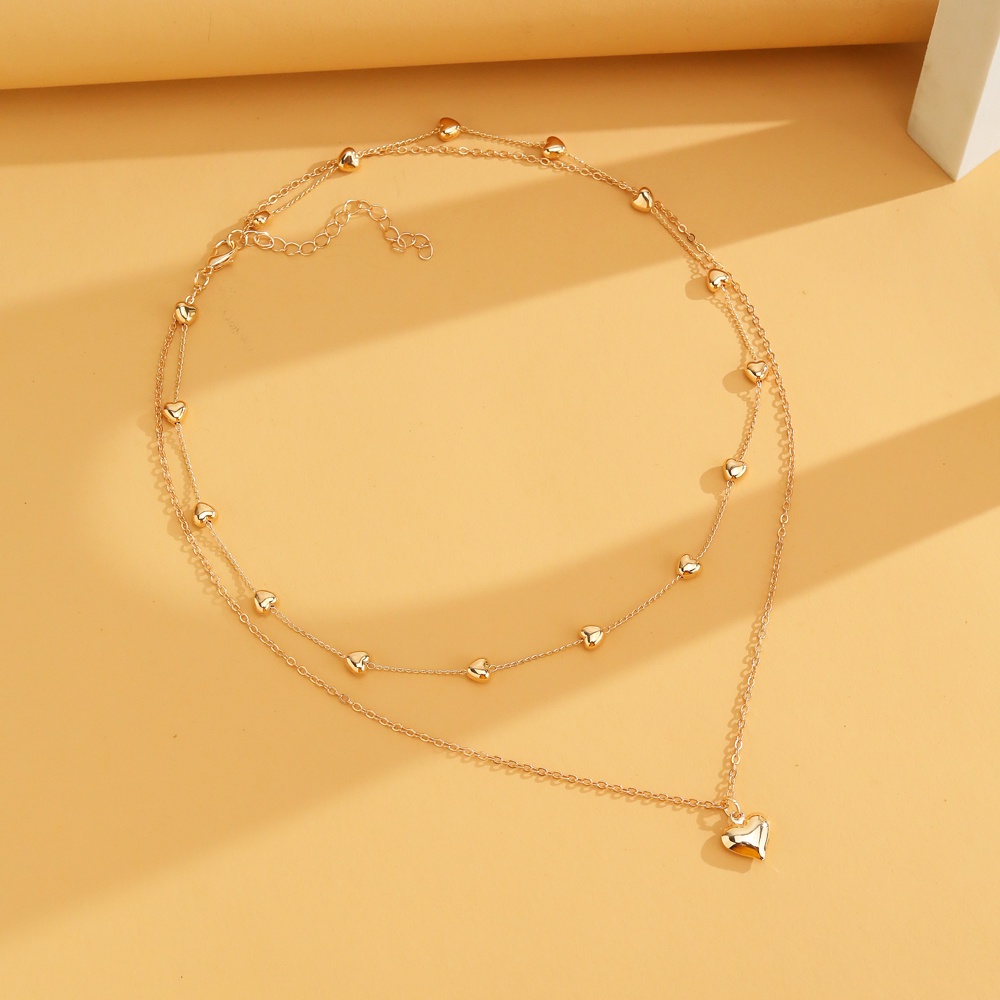 Kalung Rantai Panjang Multilayer Liontin Hati Warna Emas Gaya Bohemia Untuk Wanita