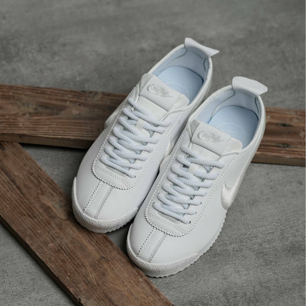all white cortez womens