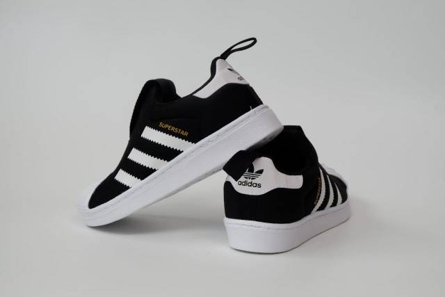 black adidas shoes superstar high top