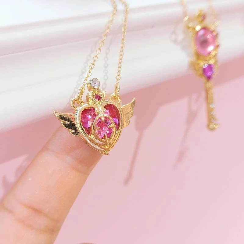 Kalung Rantai Klavikula Hias Liontin Sayap Malaikat Hati Kristal Warna Emas Bahan Alloy Untuk Wanita