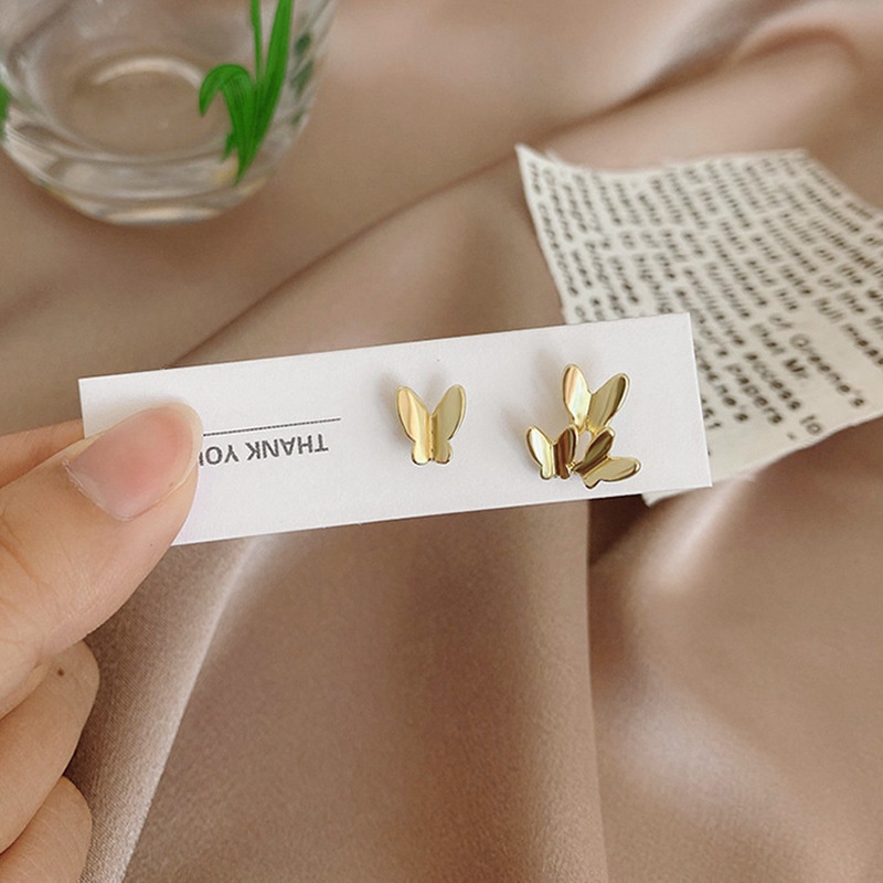 We Flower Anting Stud Desain Kupu-Kupu Asimetris Bahan S925 Silver Gaya Korea Untuk Wanita