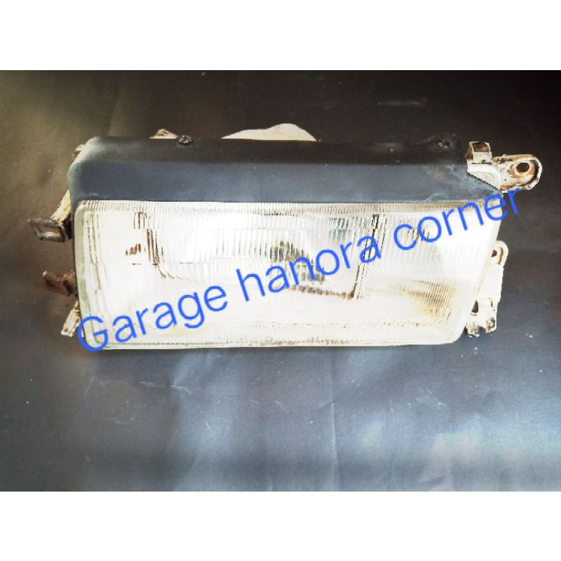 Lampu depan ford laser bagian kiri