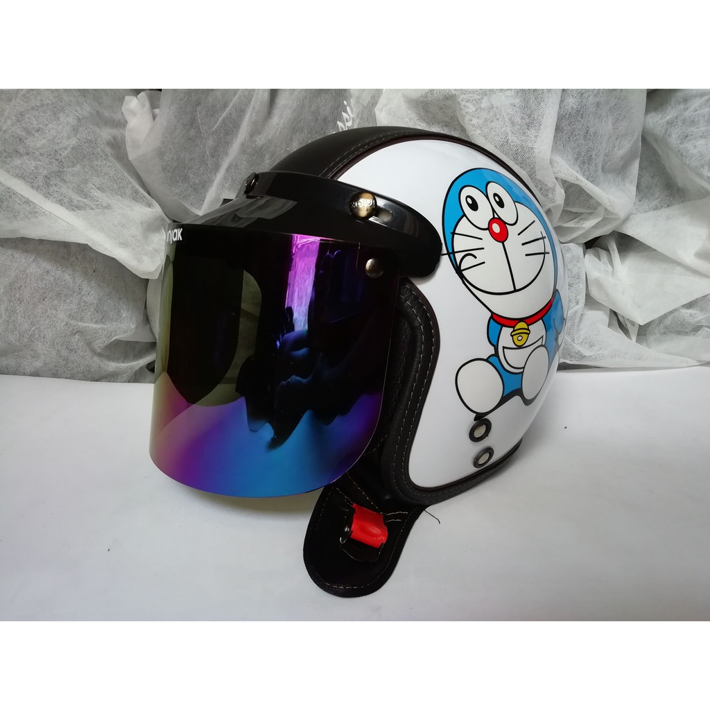 HELM BOGO DORAEMON PUTIH SEMIKULIT DEWASA KACA DATAR PELANGI