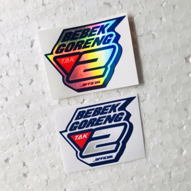 

Sticker Bebek Goreng 2 Tak Hologram dan Orajet Laminasi Glossy