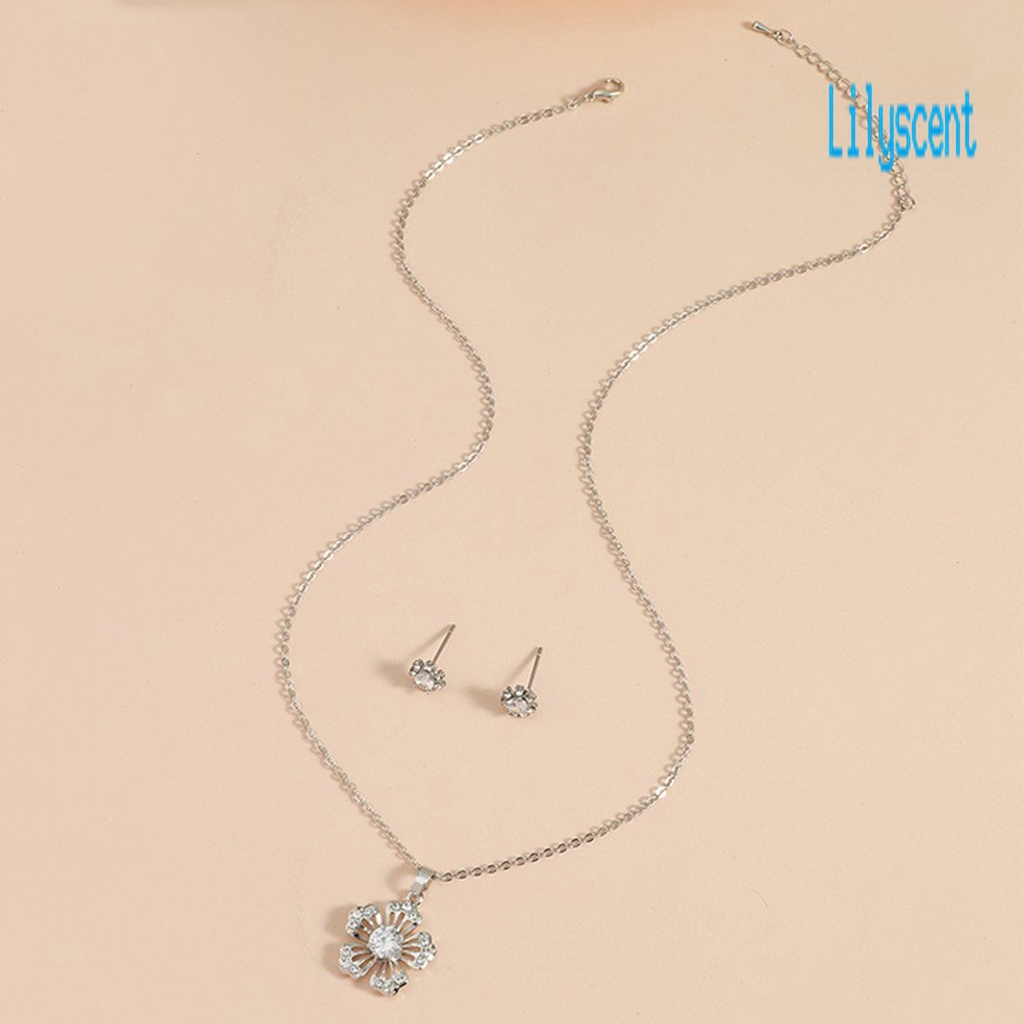 1 Set Kalung Dan Anting Bentuk Kepingan Salju Model Hollow Out Bahan Cubic Zirconia Untuk Wanita