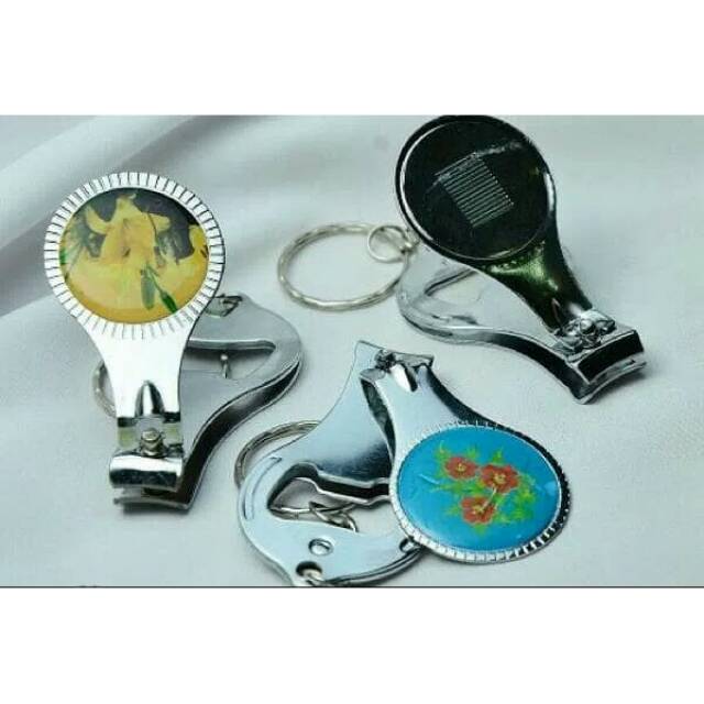 

Souvenir gunting kuku oval