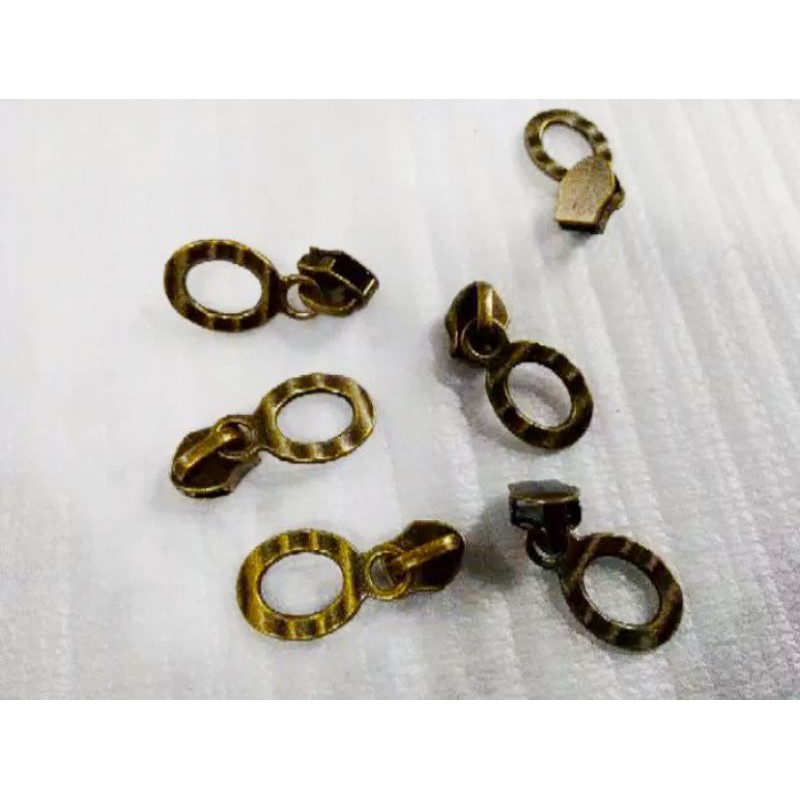 Kepala Resleting no.5 antigold. 100 pcs.