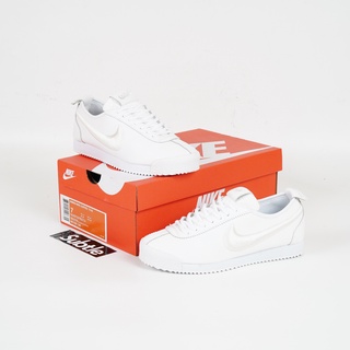 all white cortez womens