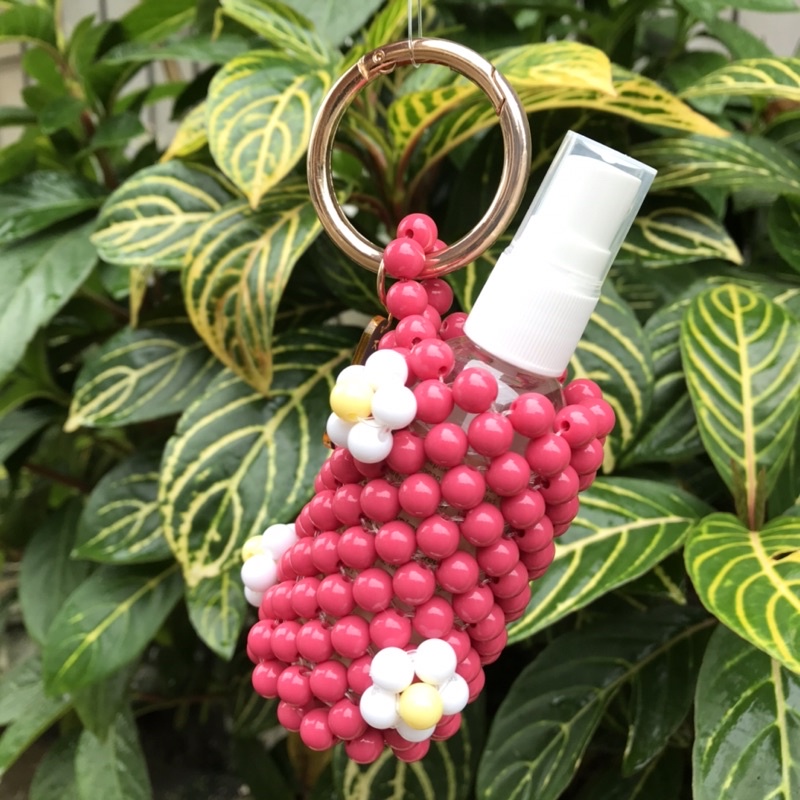 Hand sanitizer holder with daisy