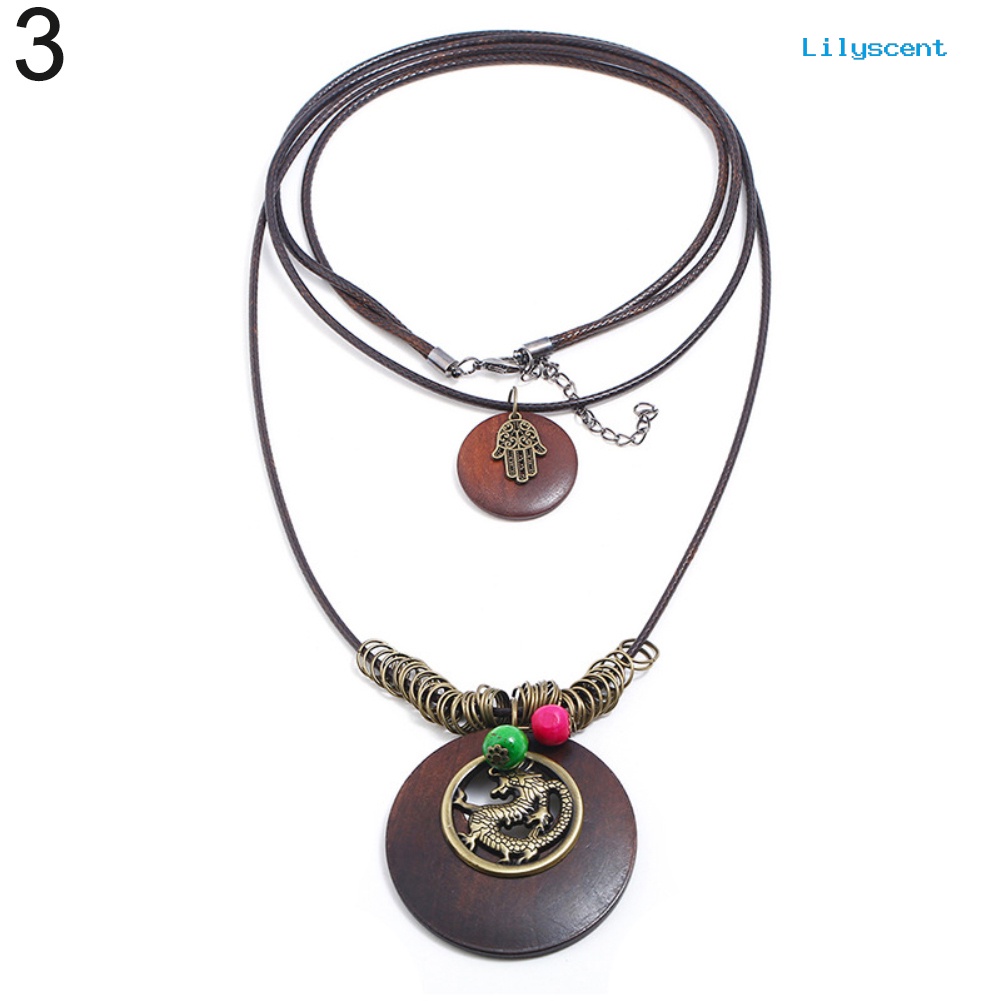 Kalung Rantai Multilayer Bahan Kayu Bentuk Daun Naga Gaya Vintage Untuk Wanita