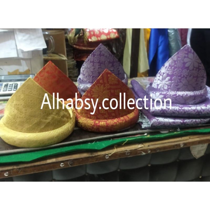 tanjak|tanjak Melayu|tanjak rumpak khas Palembang,dan Melayu lainnya/kain selendang songket/pakaian 