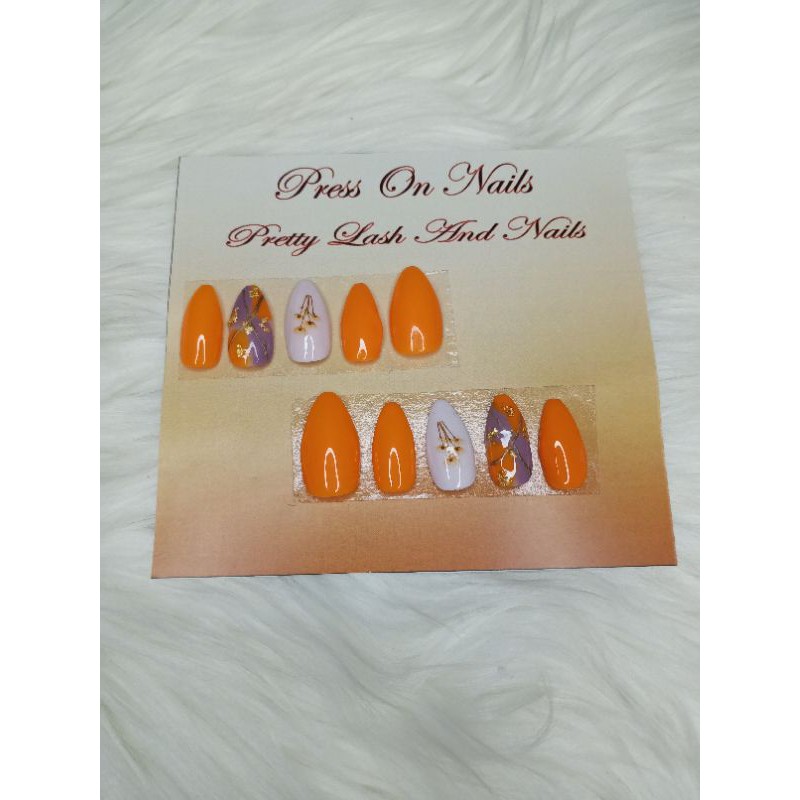 

Press On Nails Orange Color with hand painting and flower sticker