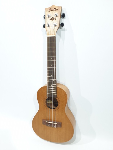 Ukulele Concerto Merk Shelby Tipe SU-23 M STNT Original Ukuran 23 Inc Warna Coklat Tua Ukir Murah