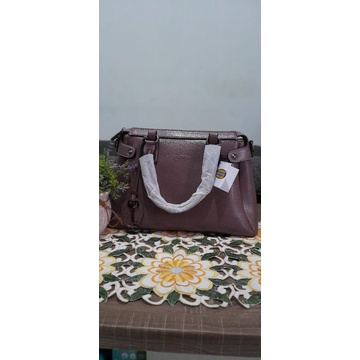 Tas wanita fosil ungu